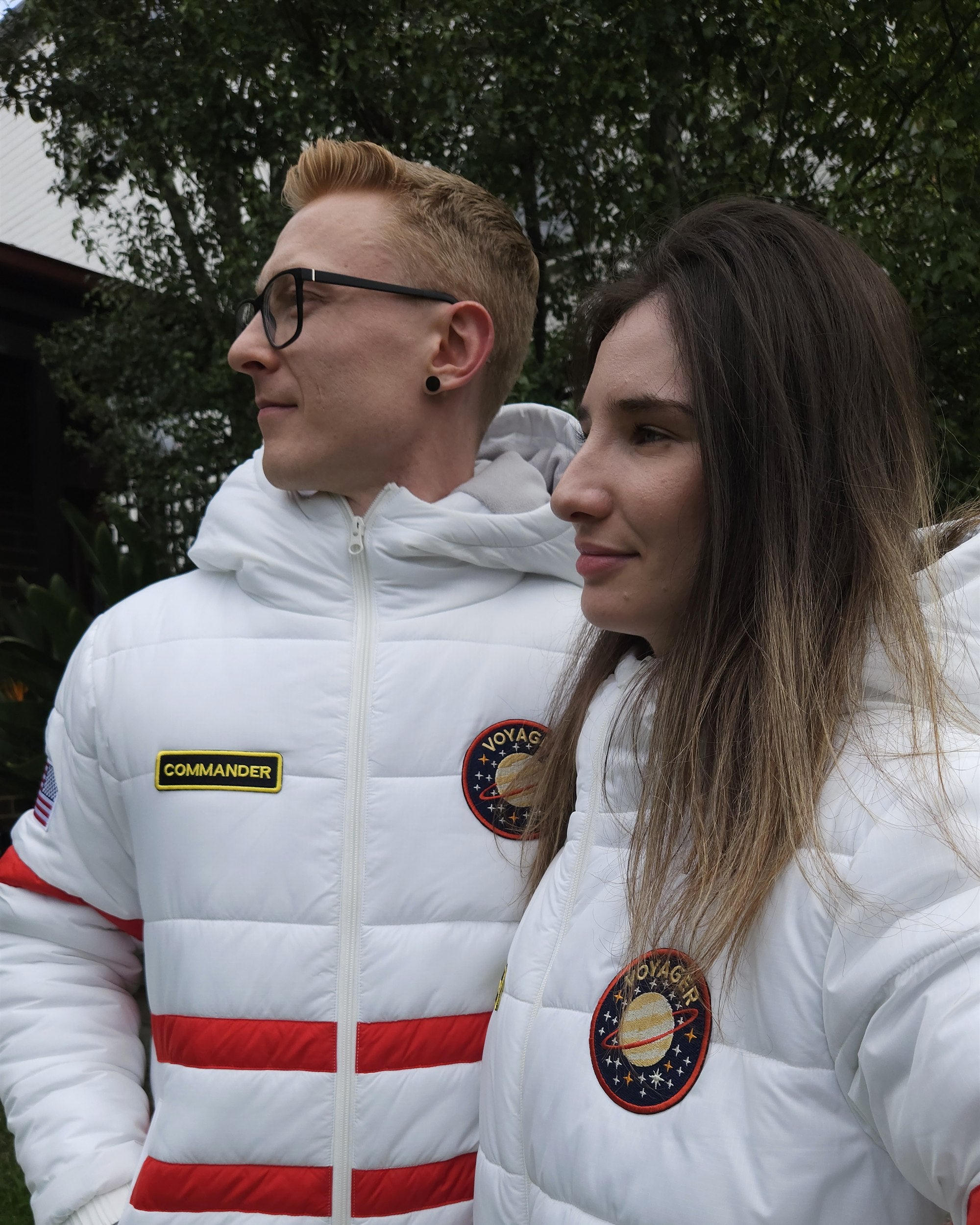 Two people wearing Zoot Suits outside at night